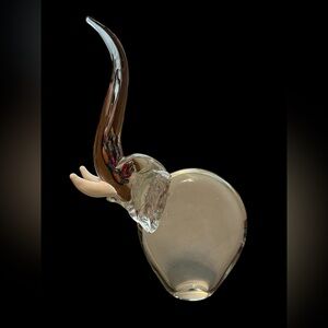 Vintage glass elephant paperweight with white glass tusks